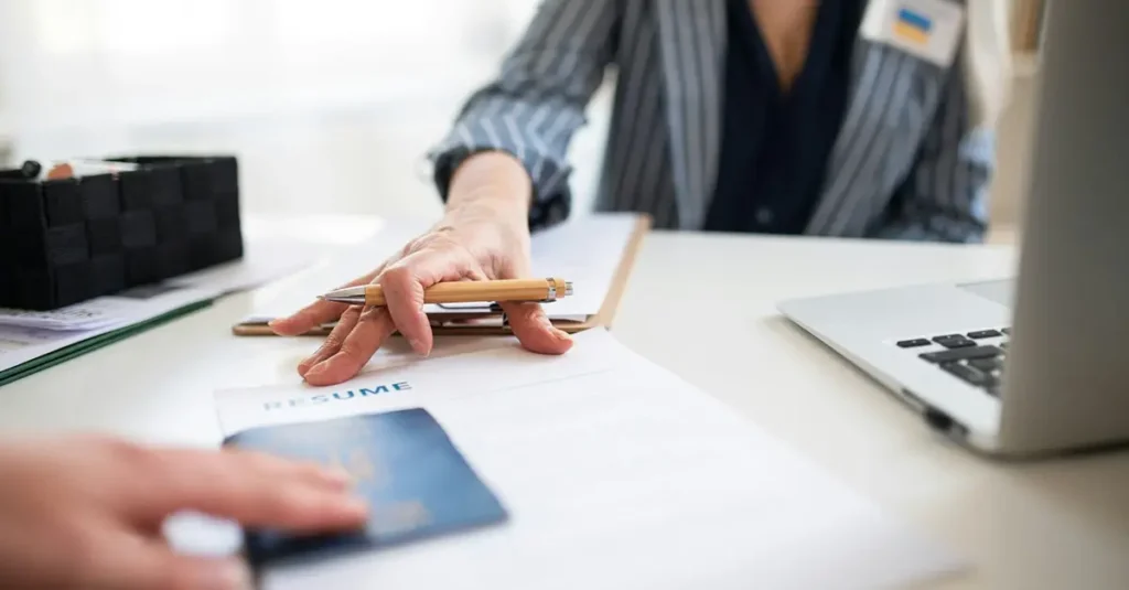 Employee providing immigration documents to their employer's HR department.