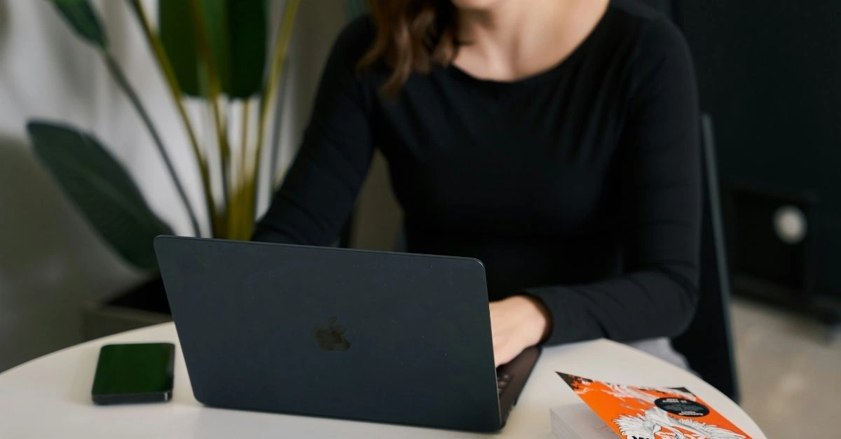 female HR assistant using laptop