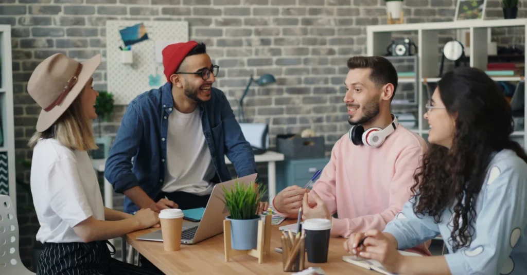 Employees discussing decentralised DEI at work.