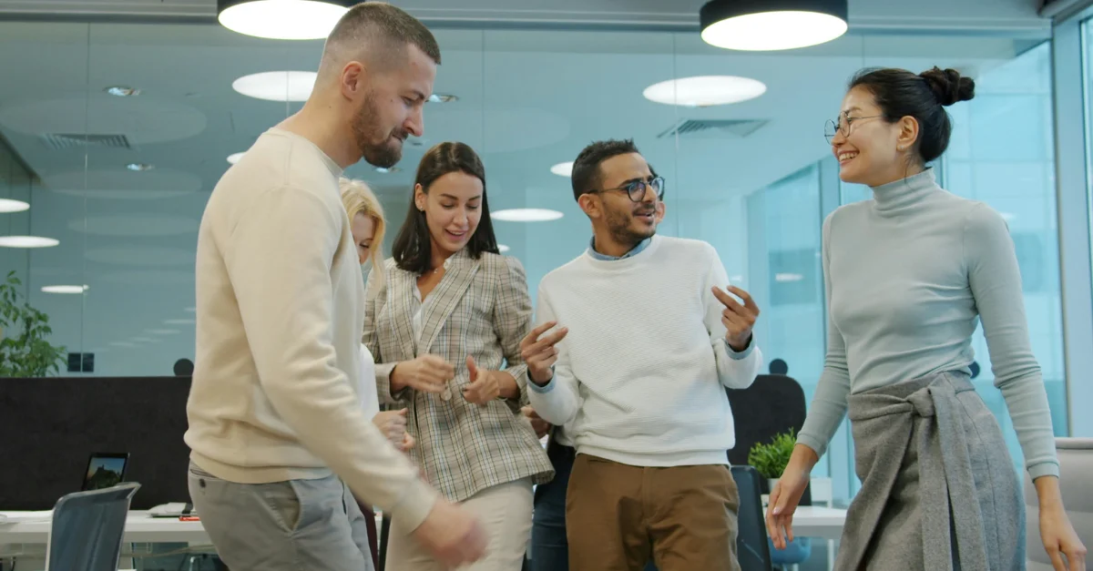 Diverse employees in a modern office space.