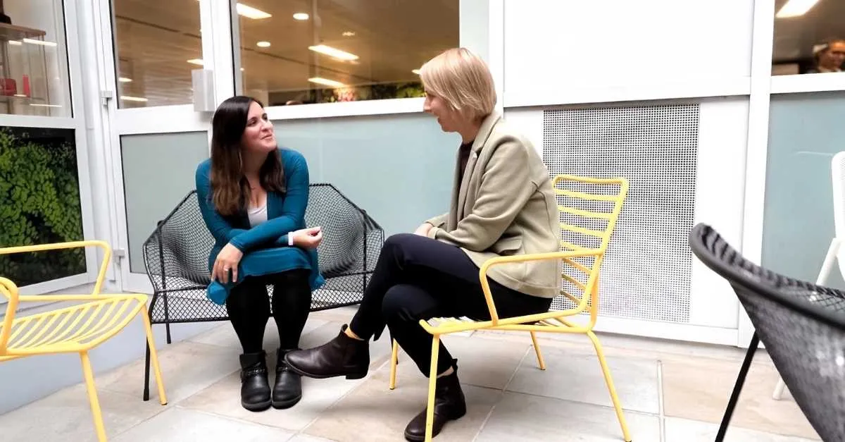 Brightmine colleagues discussing pay trends october 2025