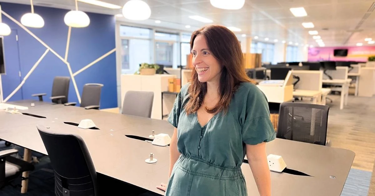 Smiling female HR professional standing in an empty office