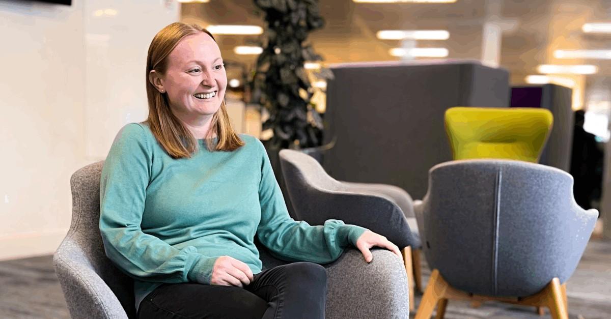 Brightmine employee sitting in chair discussing Employment Rights Act