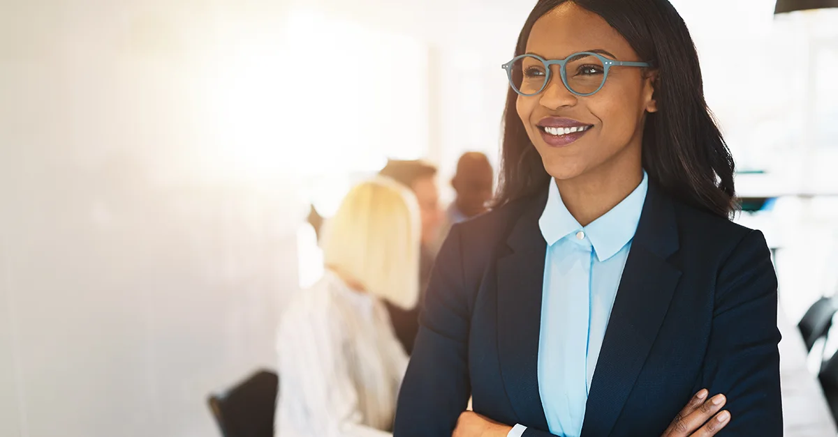 Confident businesswoman smiling in a modern office