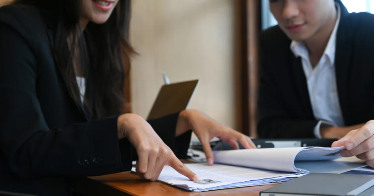 HR generalists reviewing FMLA and FLSA guidance on self-reporting violations.