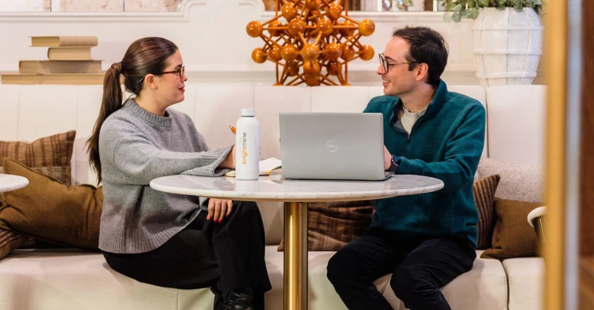 Two HR professionals discussing pay strategies