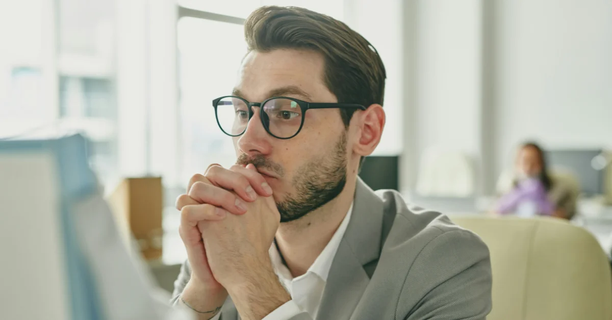 HR manager reading the news of the 2025 government shutdown.