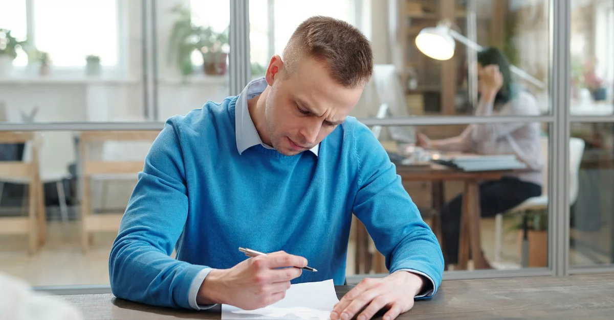 Employee reading through H1-B visa documents.