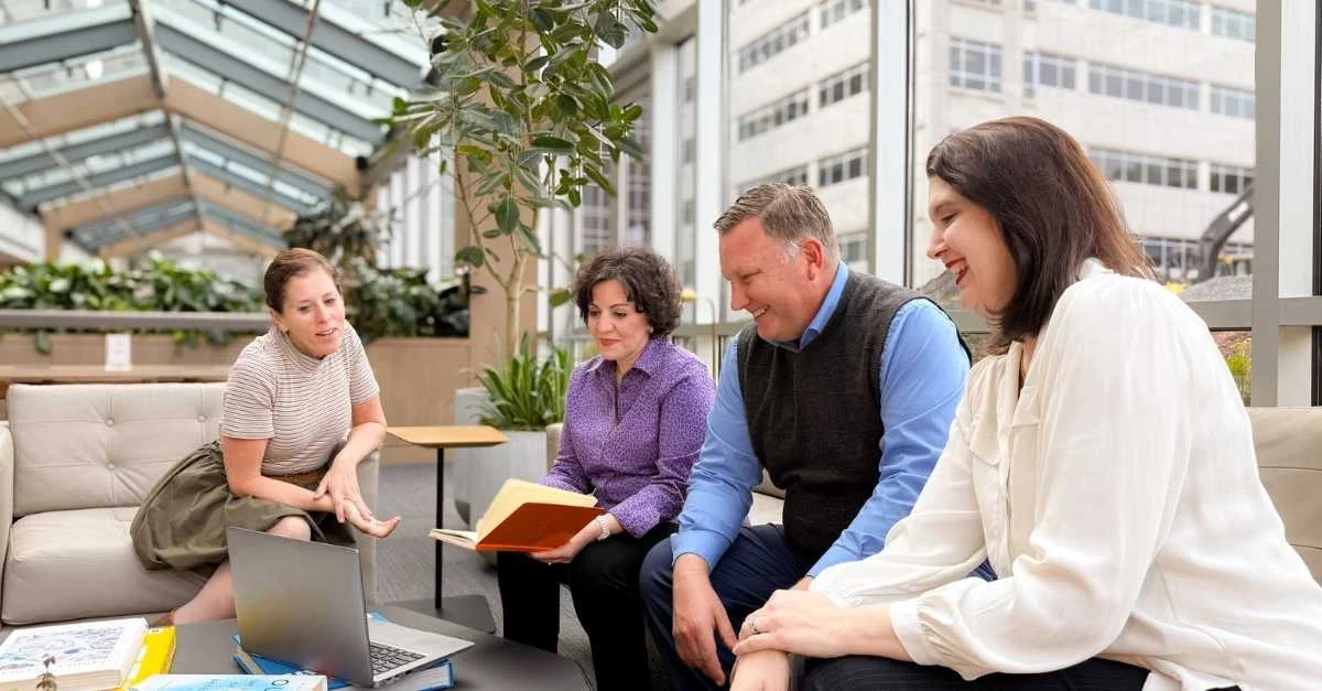 HR colleagues discussing the Brightmine Brighter Workplace Awards