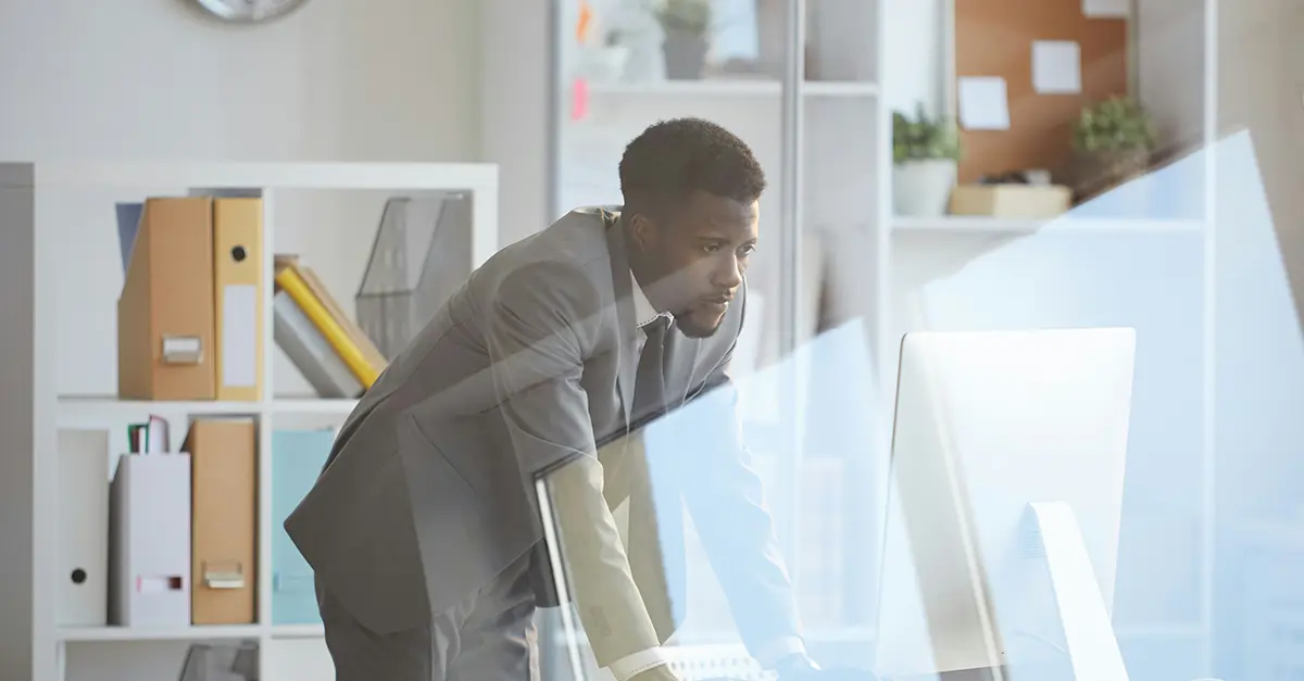 Office worker leaning on table