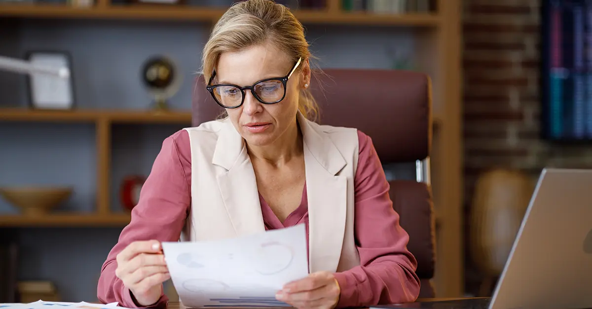 Female office worker reviewing charts