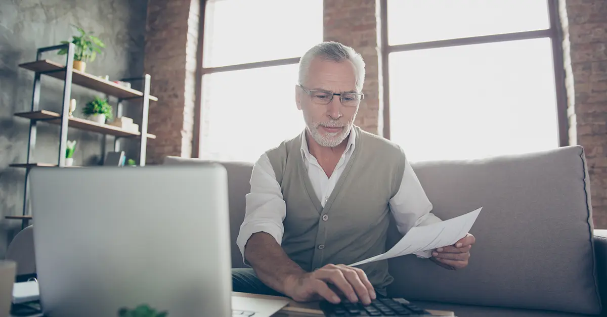 Brightmine office worker using calculator