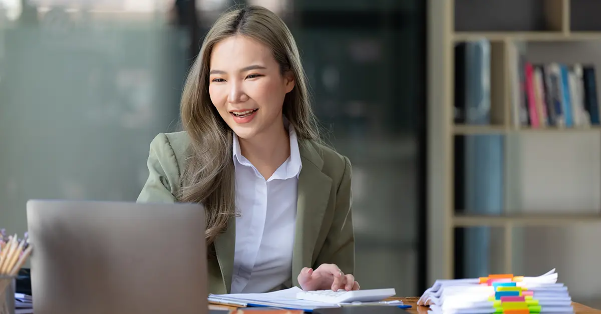 Brightmine office worker working on her laptop