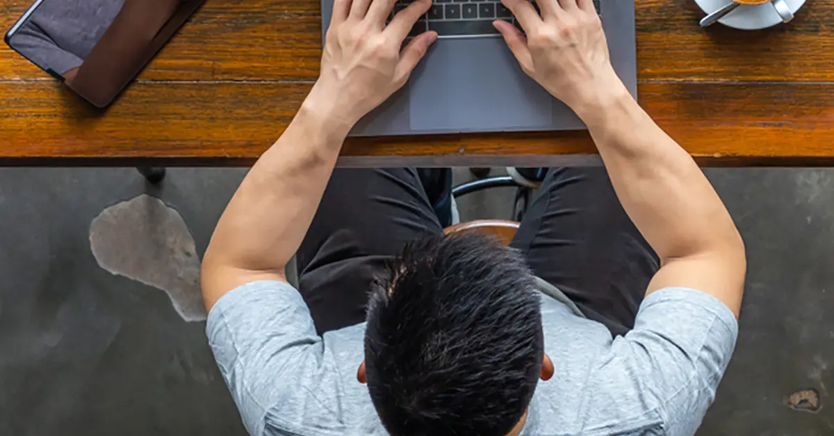 Brightmine office worker working on his laptop
