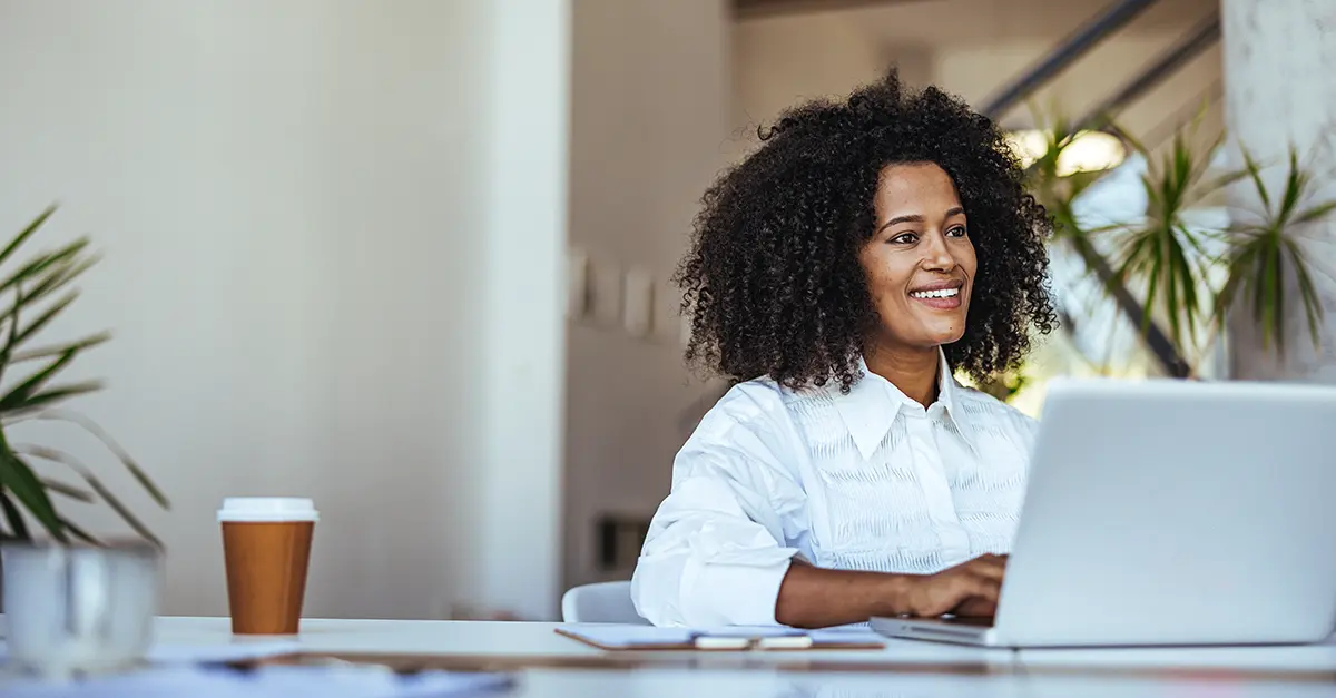 Brightmine office worker working on her laptop