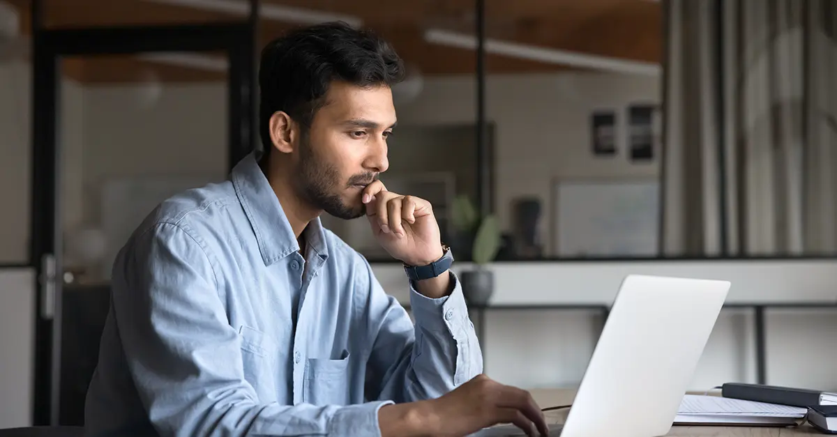 Brightmine-office worker using his laptop