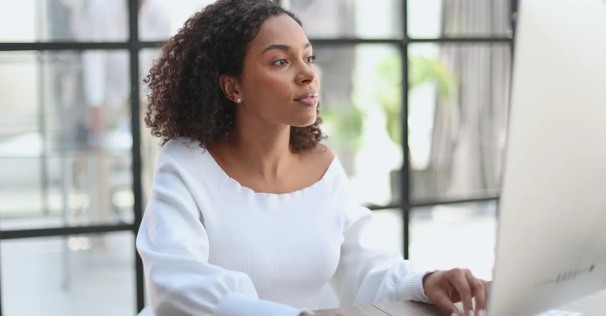 Brightmine-office worker using her computer