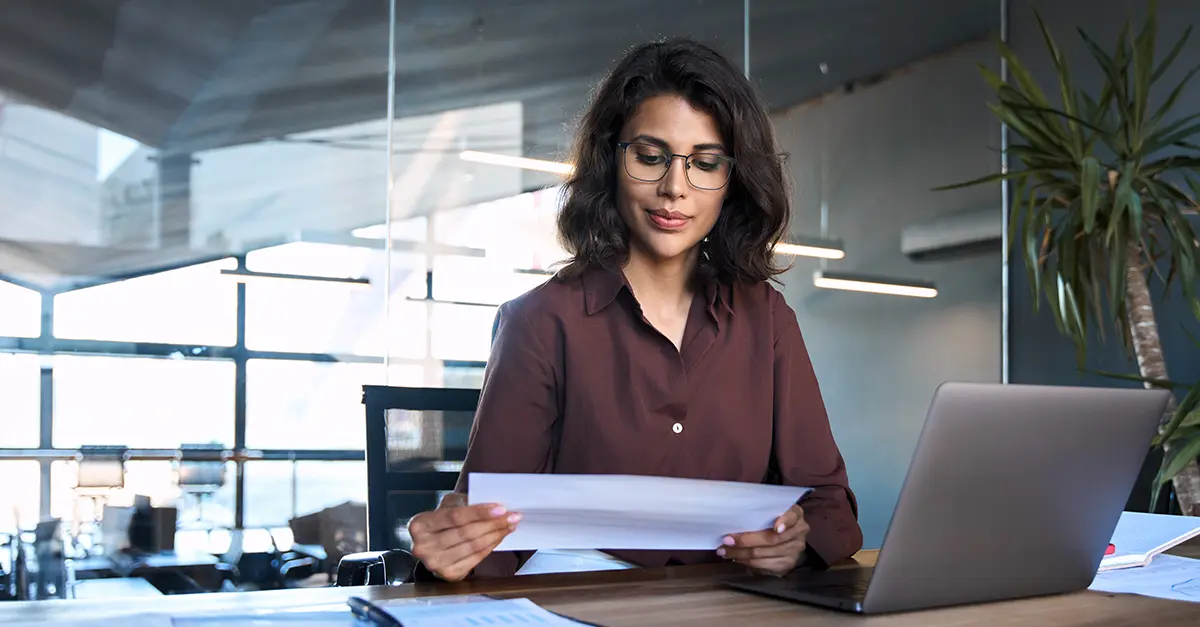 Brightmine office worker reviewing notes