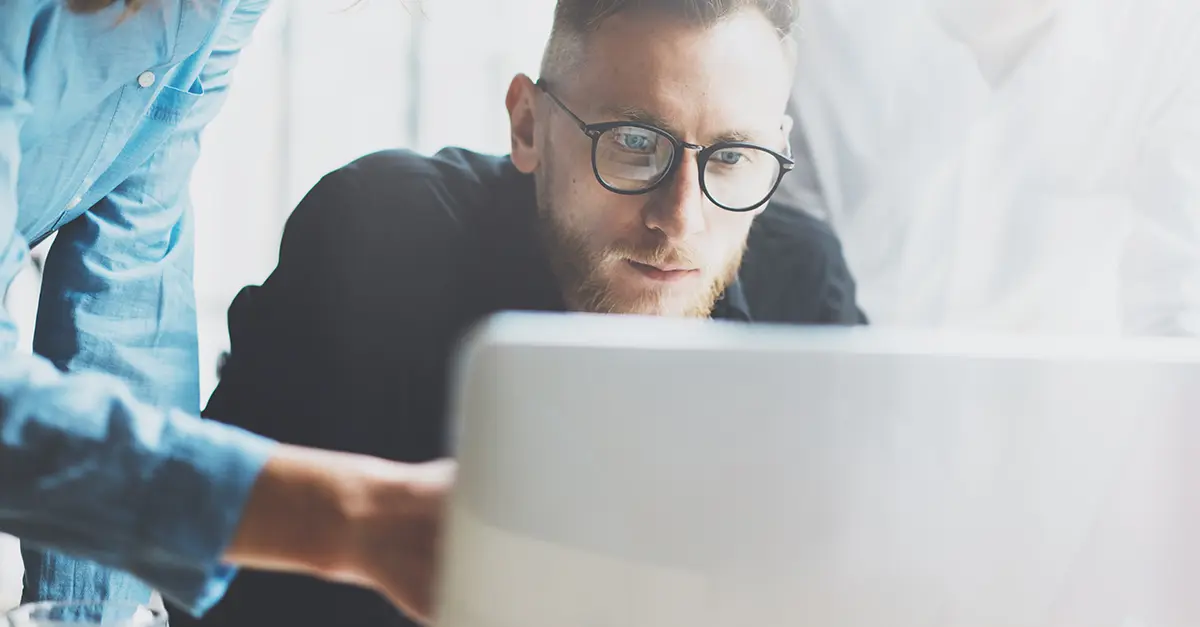 Brightmine office worker discussing